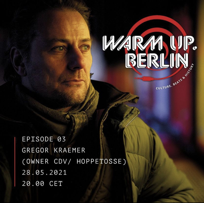 A man looks right in a dimly lit setting, with red and white text overlays reading Warm Up Berlin and details about Gregor Kraemer.